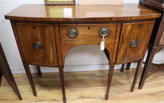 A George III mahogany bowfront and satinwood crossbanded sideboard W.117cm